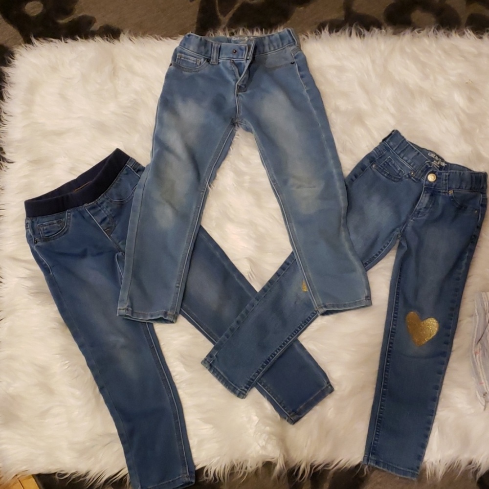 Three pairs of jeans one top and two shorts
